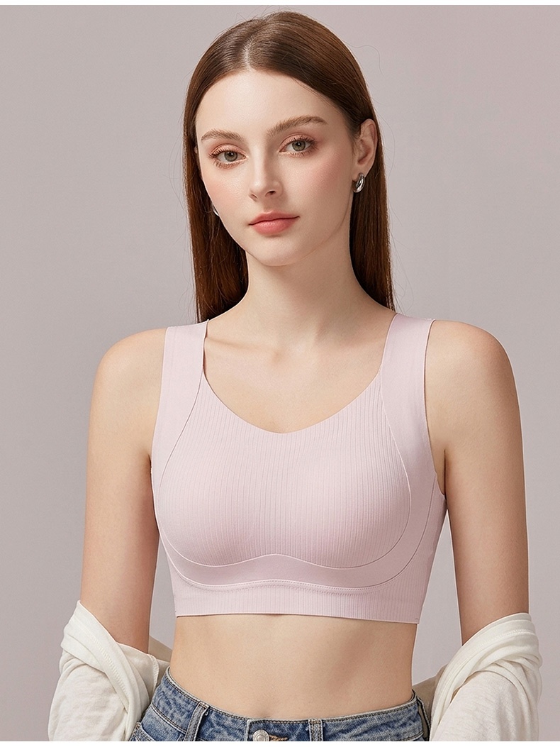 Model wearing pink seamless bra in front view with wide straps VEIMIA