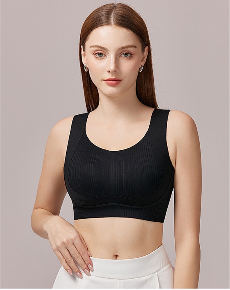 Model wearing black seamless bra in front view with wide straps VEIMIA
