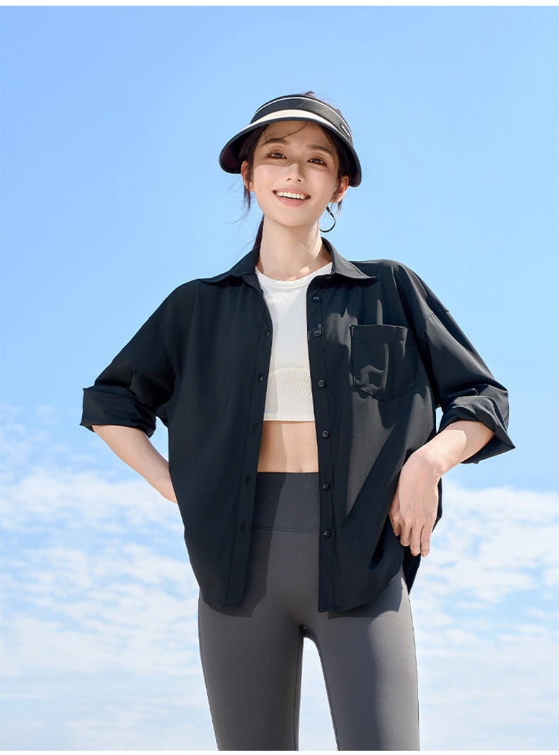 Model wearing black UV sun protection jacket with visor outdoors - VEIMIA