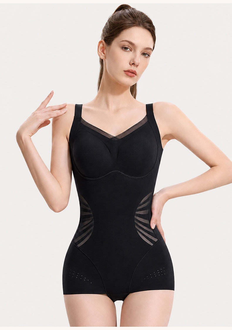 Model wearing black sculpting bodysuit in front view with side mesh panels VEIMIA