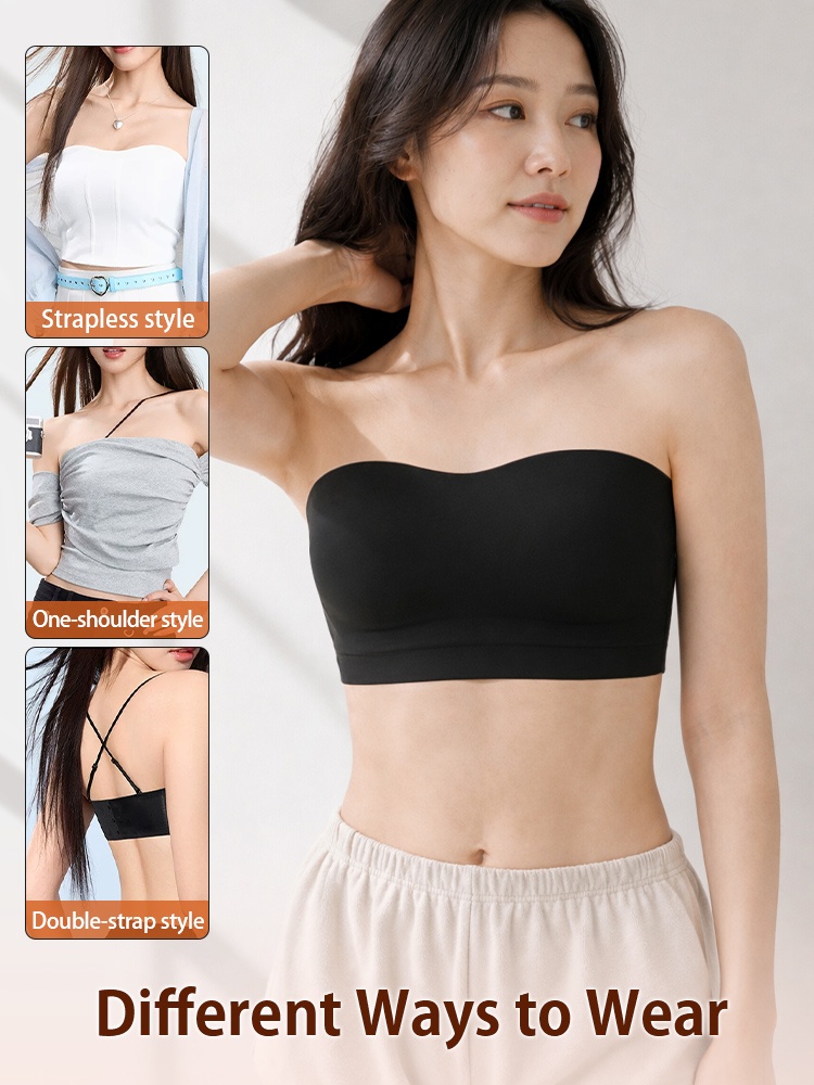 Model wearing black strapless bra with multiple wearing styles demonstration VEIMIA