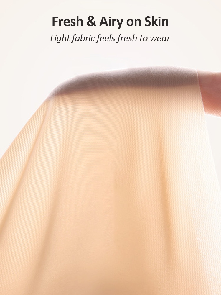 Close-up of lightweight beige fabric draped over a finger VEIMIA