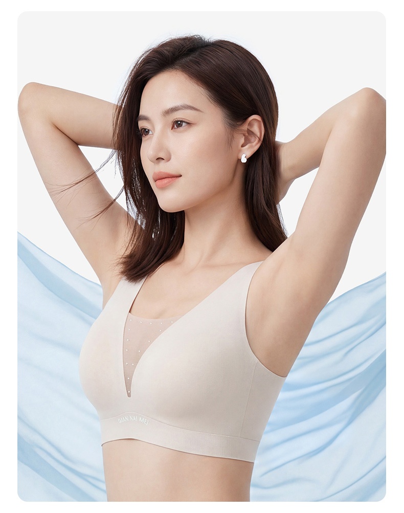 Side view of model wearing beige bra with wide straps VEIMIA