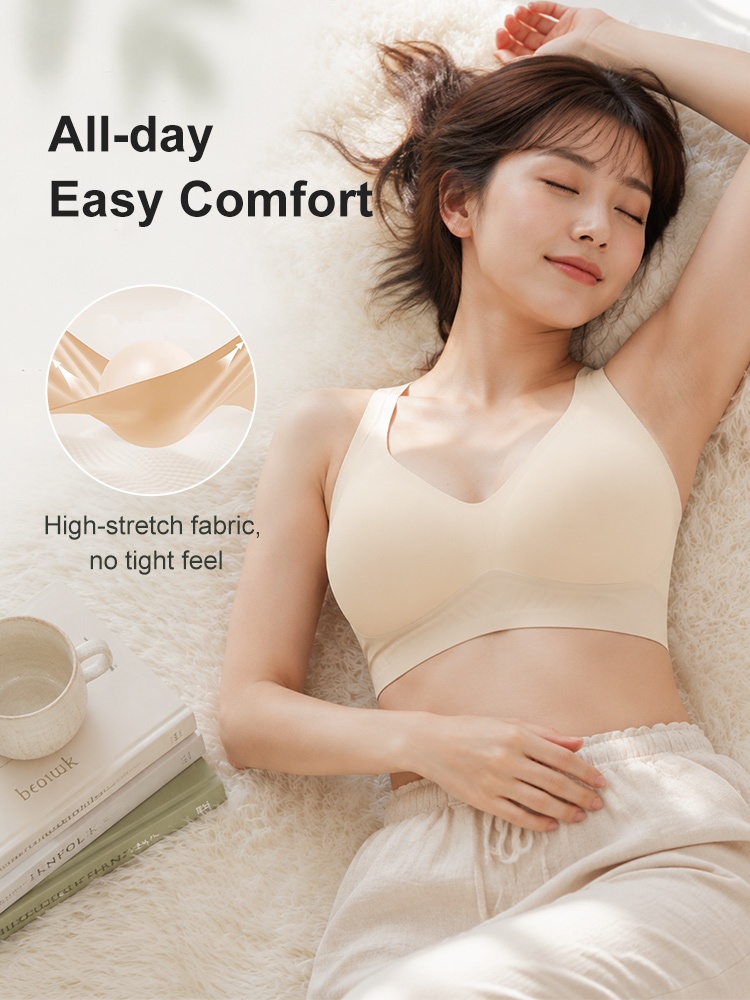 Model reclining in beige wireless bra with high stretch fabric VEIMIA