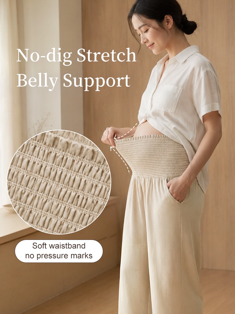 Close-up of beige maternity pants with flexible smocked waistband and side pocket VEIMIA
