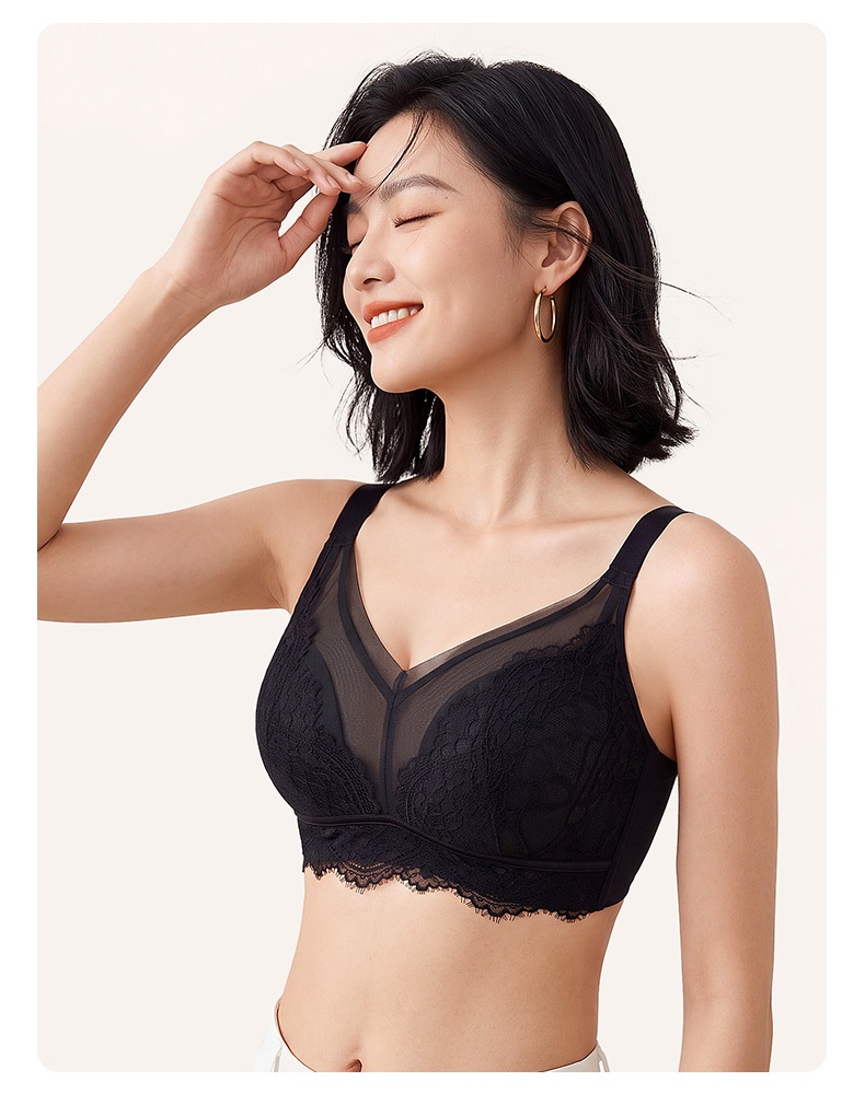 Model wearing black lace bra with sheer V neckline and wide straps VEIMIA