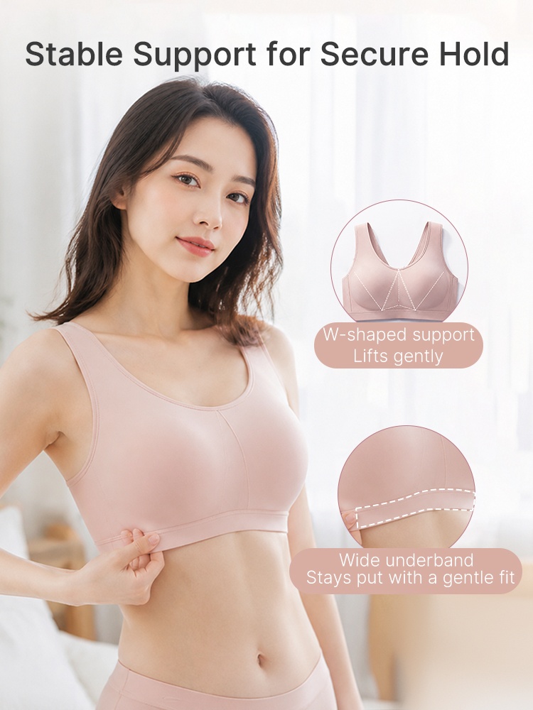 Model wearing pink wireless bra with W-shaped support and wide underband VEIMIA