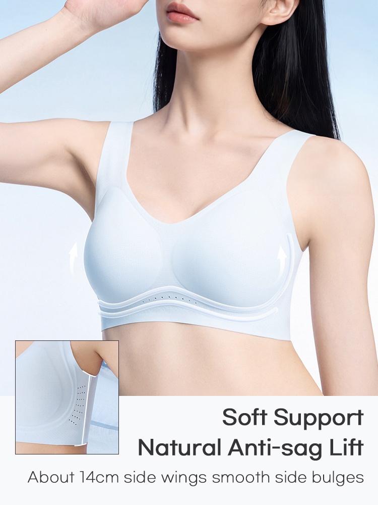 Model wearing light blue seamless bra with side support wings VEIMIA