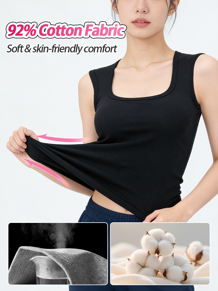 Model wearing black built-in bra tank top styled with light pants VEIMIA