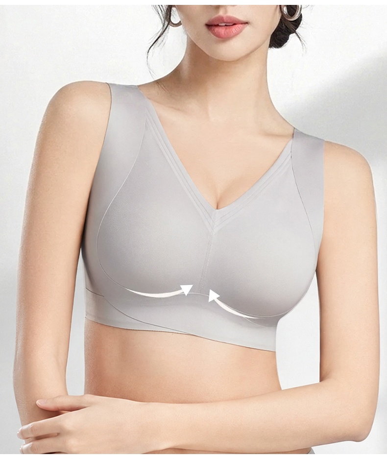 Model wearing gray V-neck bra front view with upward support arrows VEIMIA