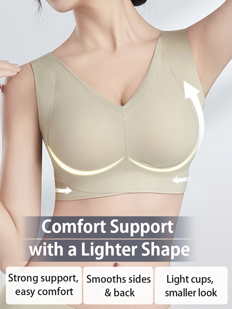 Model wearing light green V-neck bra with wide underband and upward support arrows VEIMIA