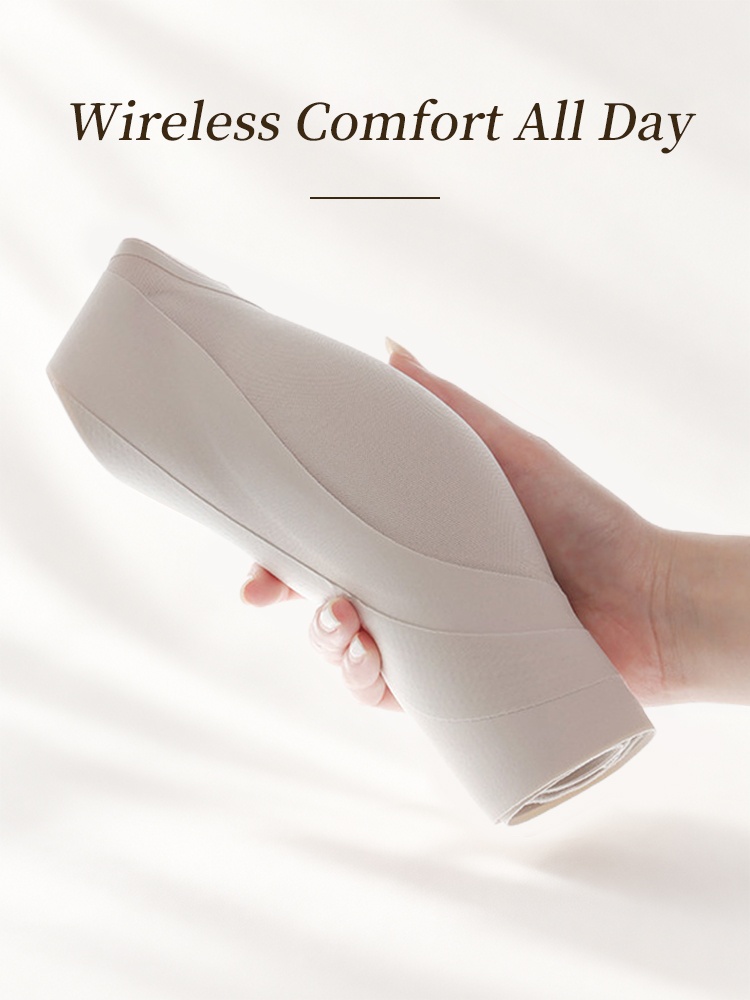 Folded beige wireless bra demonstrating soft flexible construction VEIMIA