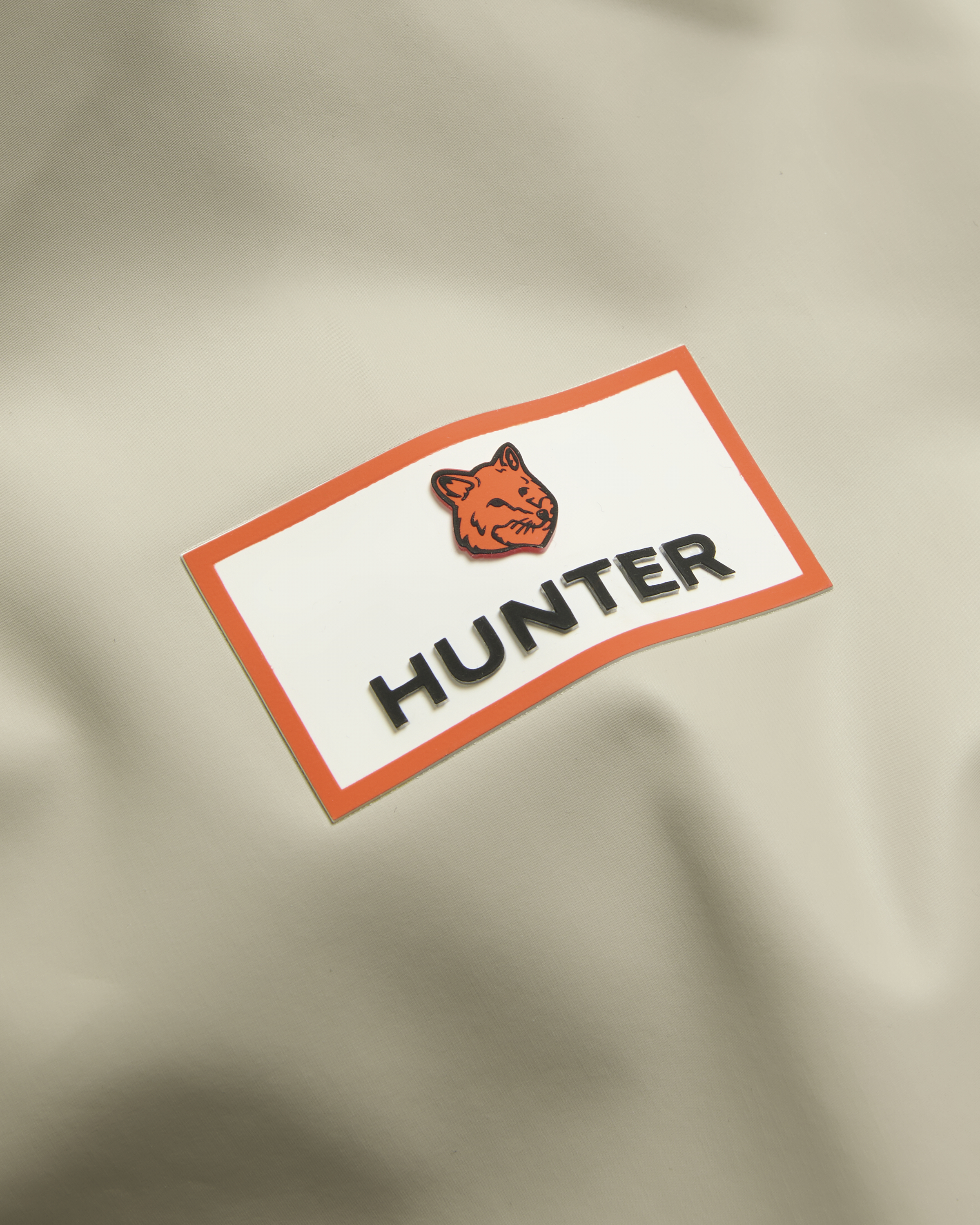 MAISON KITSUNE X HUNTER RAIN JACKET