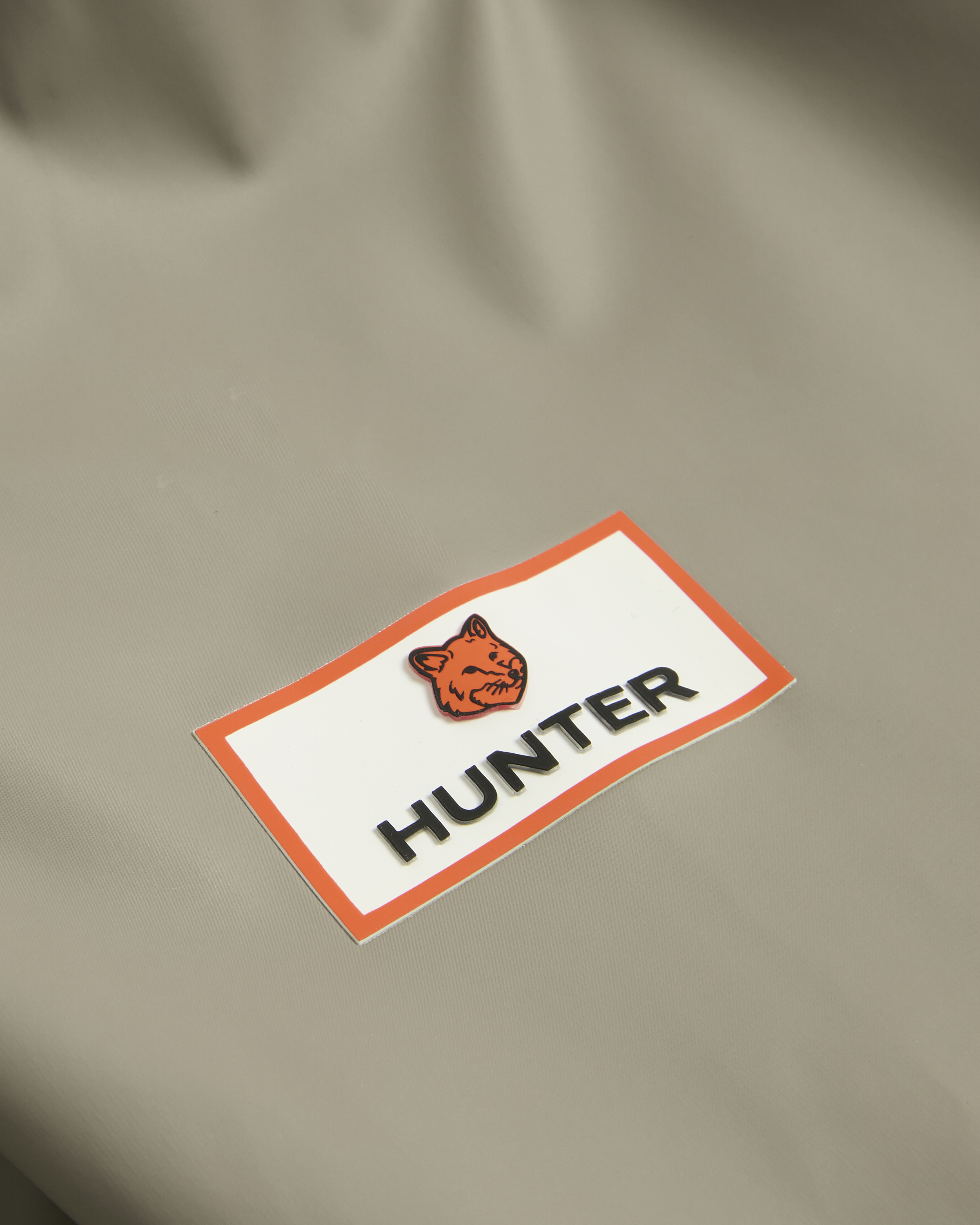 MAISON kITSUNE X HUNTER RAIN CLOAK