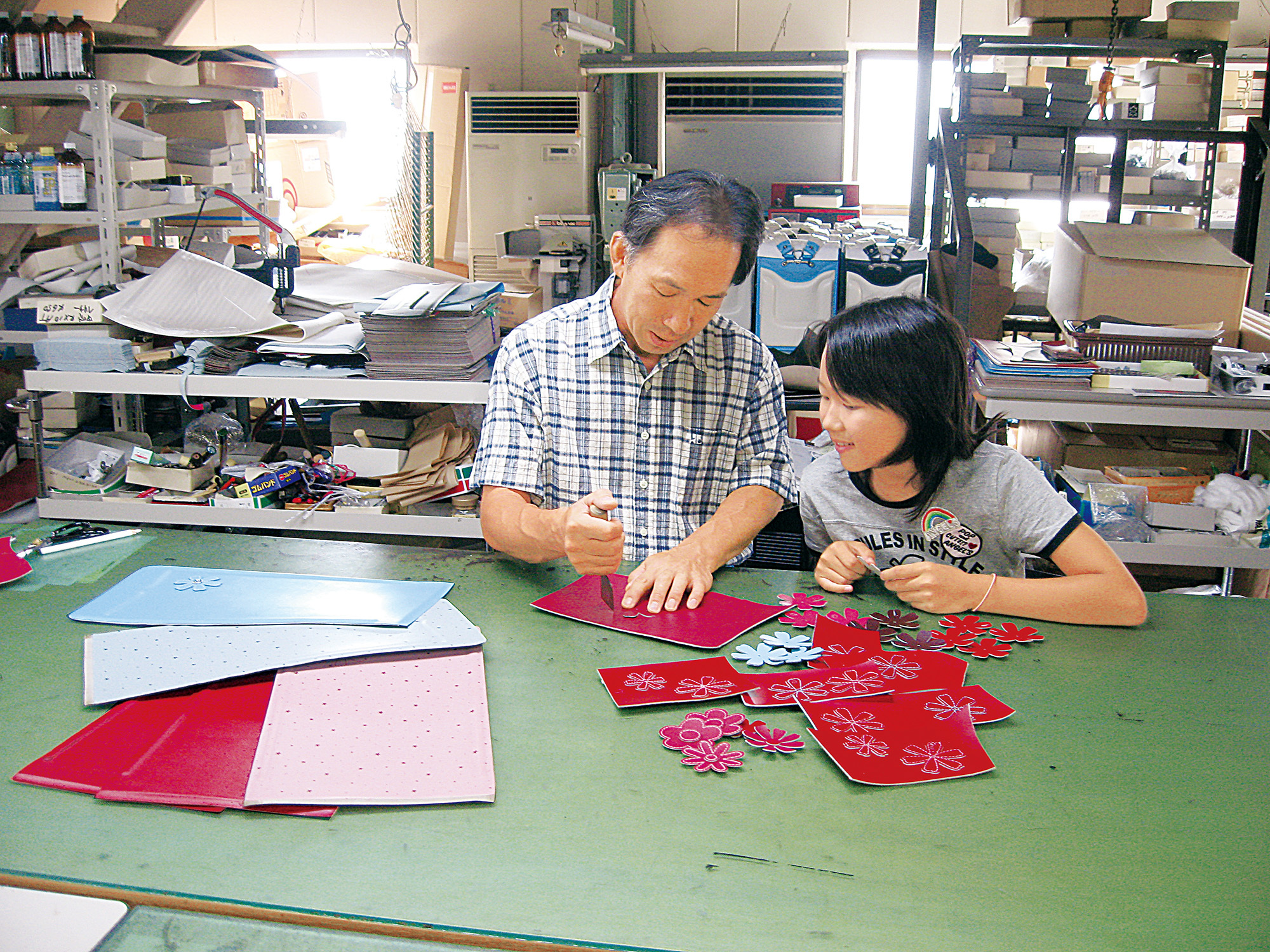 {"default":"a man making randoseru with his daughter"}