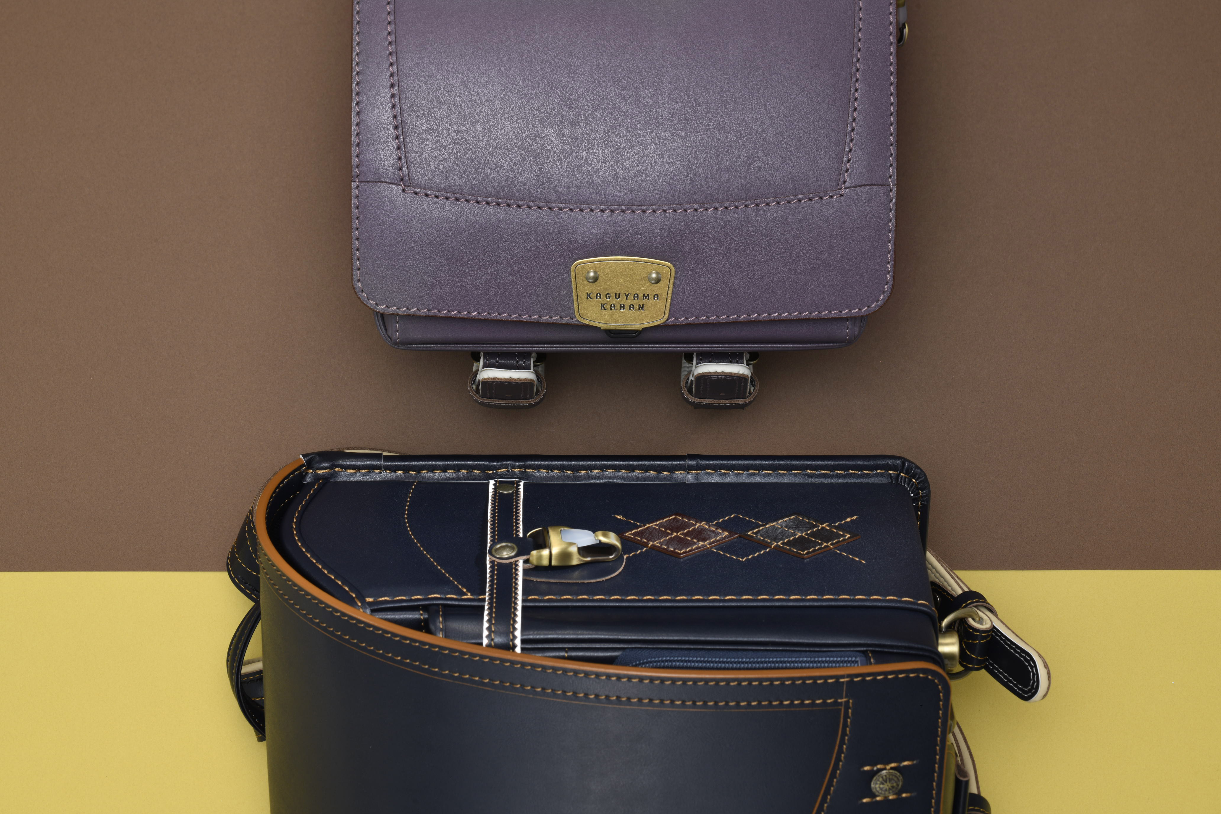 {"default":"smoky purple randoseru, black and orange randoseru with argyle shaped bridle leather"}