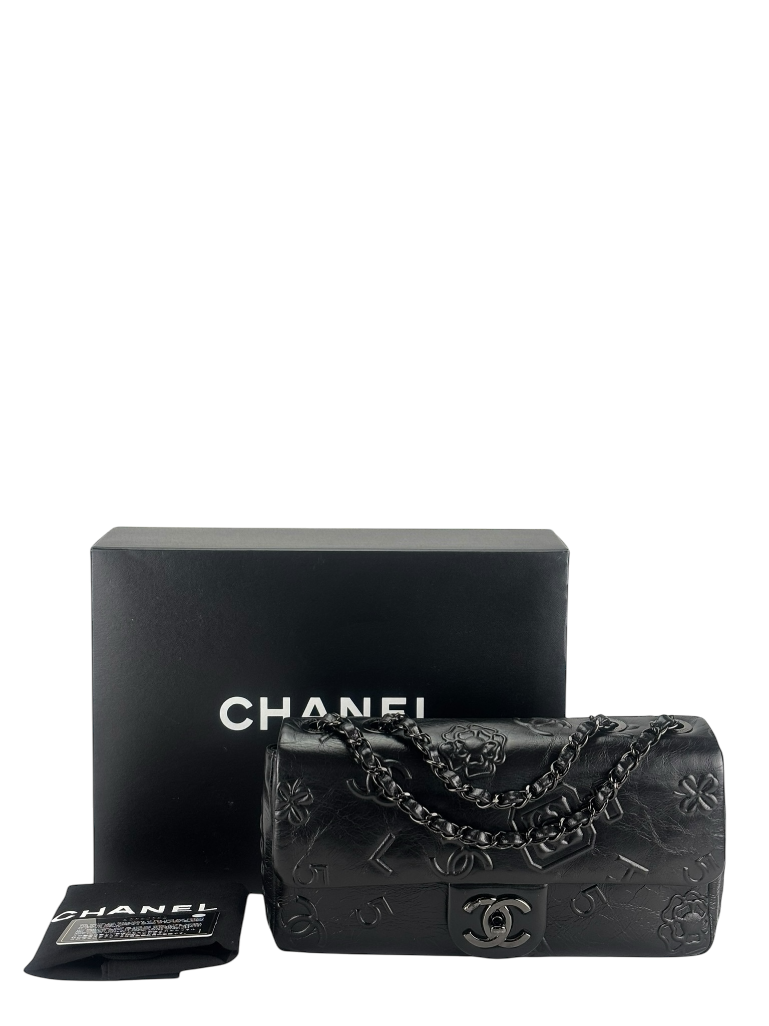 CHANEL - All Black Calfskin Precious Symbols Embossed Flap Bag
