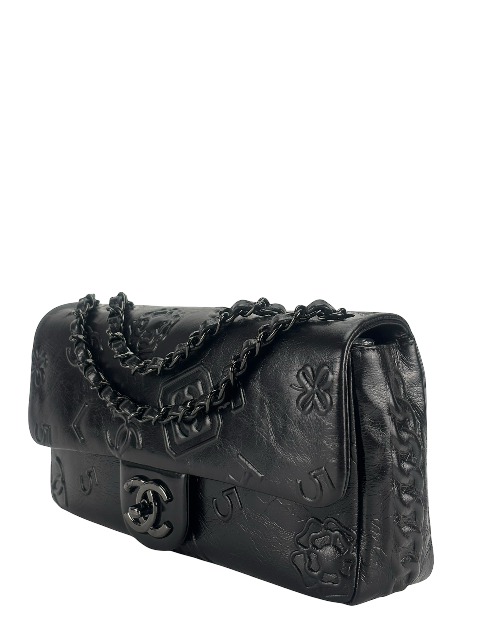 CHANEL - All Black Calfskin Precious Symbols Embossed Flap Bag