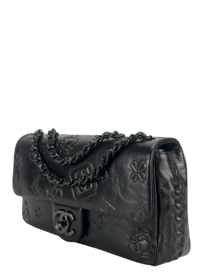 CHANEL - All Black Calfskin Precious Symbols Embossed Flap Bag