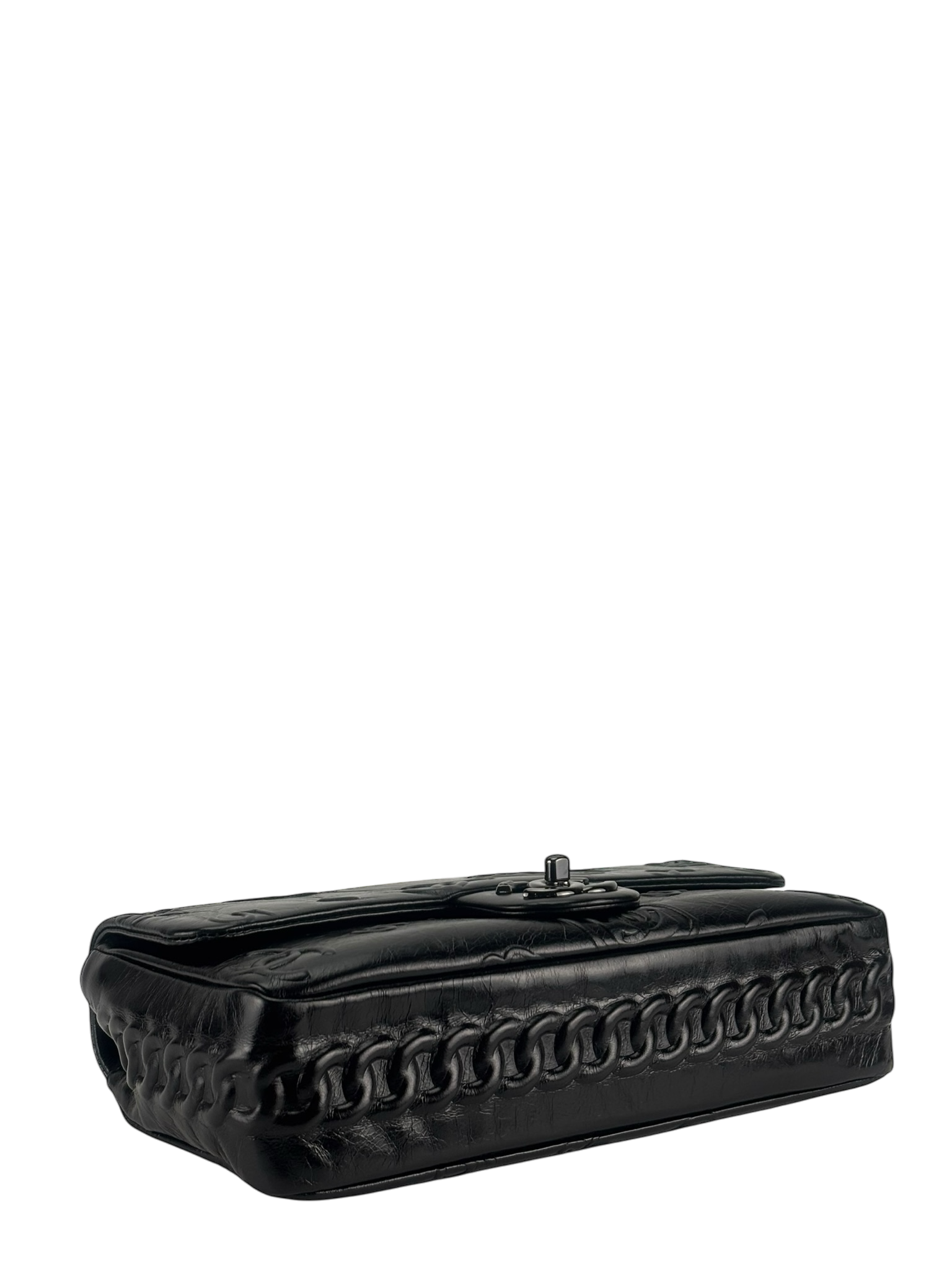 CHANEL - All Black Calfskin Precious Symbols Embossed Flap Bag