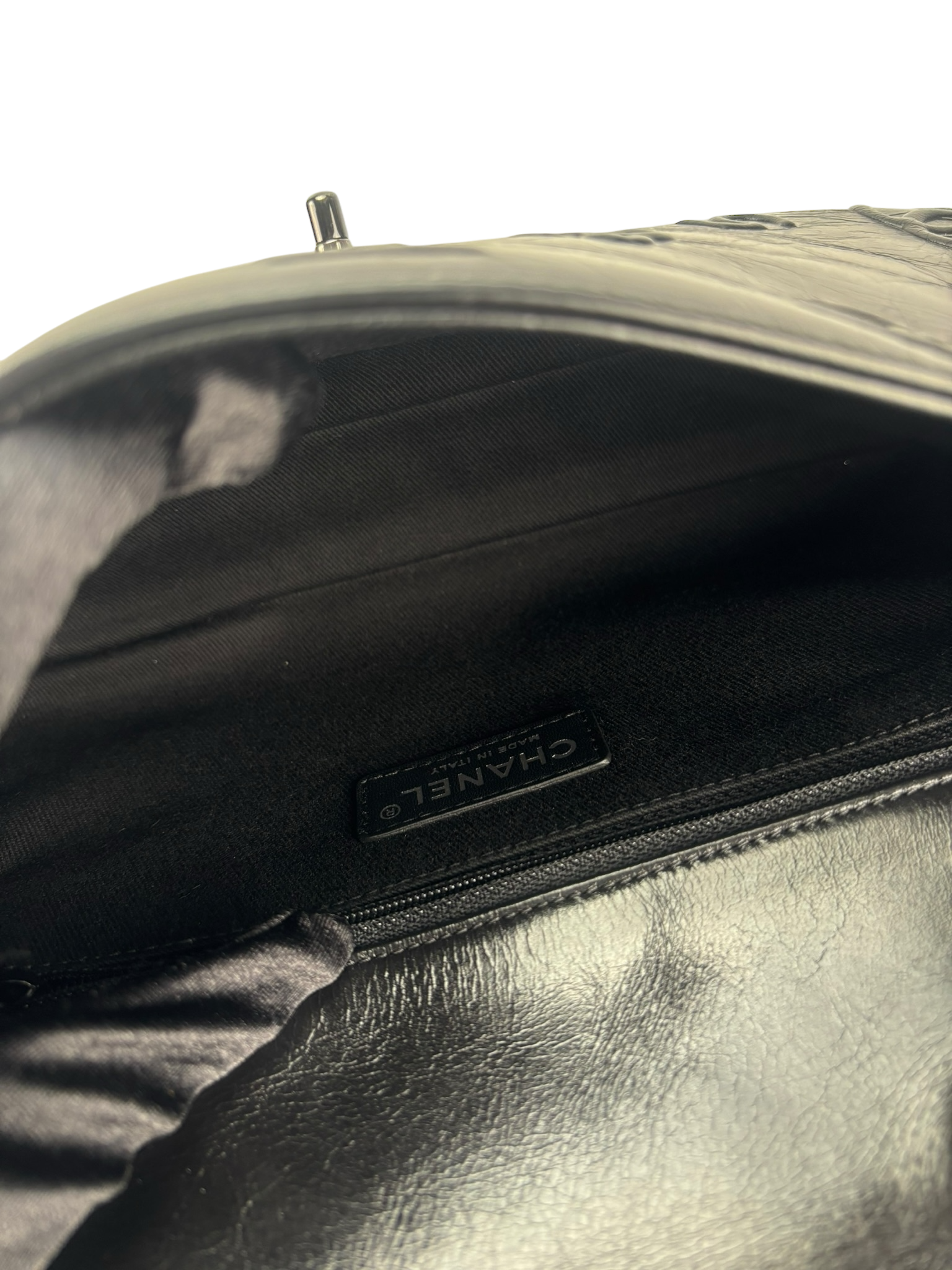 CHANEL - All Black Calfskin Precious Symbols Embossed Flap Bag