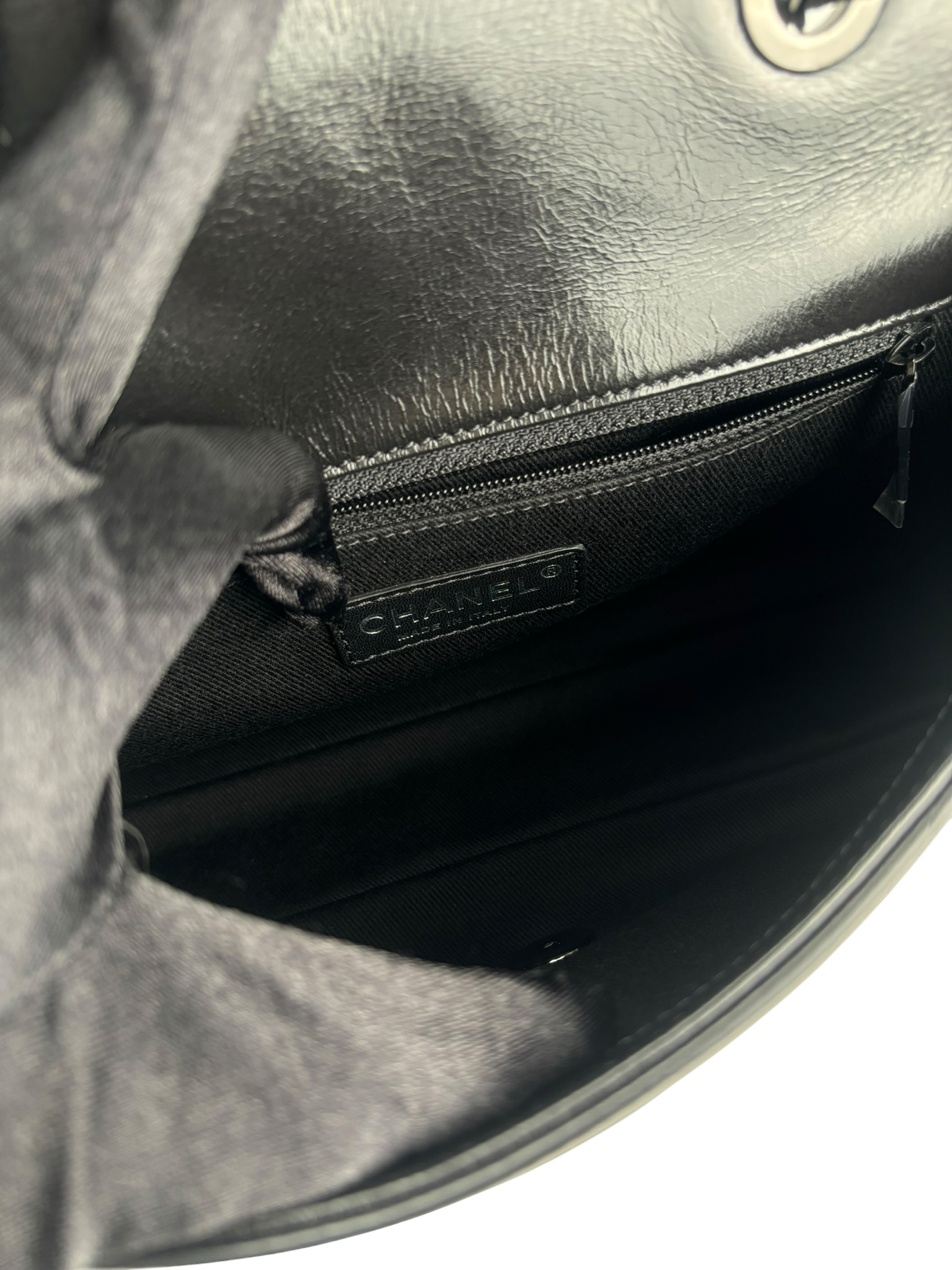 CHANEL - All Black Calfskin Precious Symbols Embossed Flap Bag