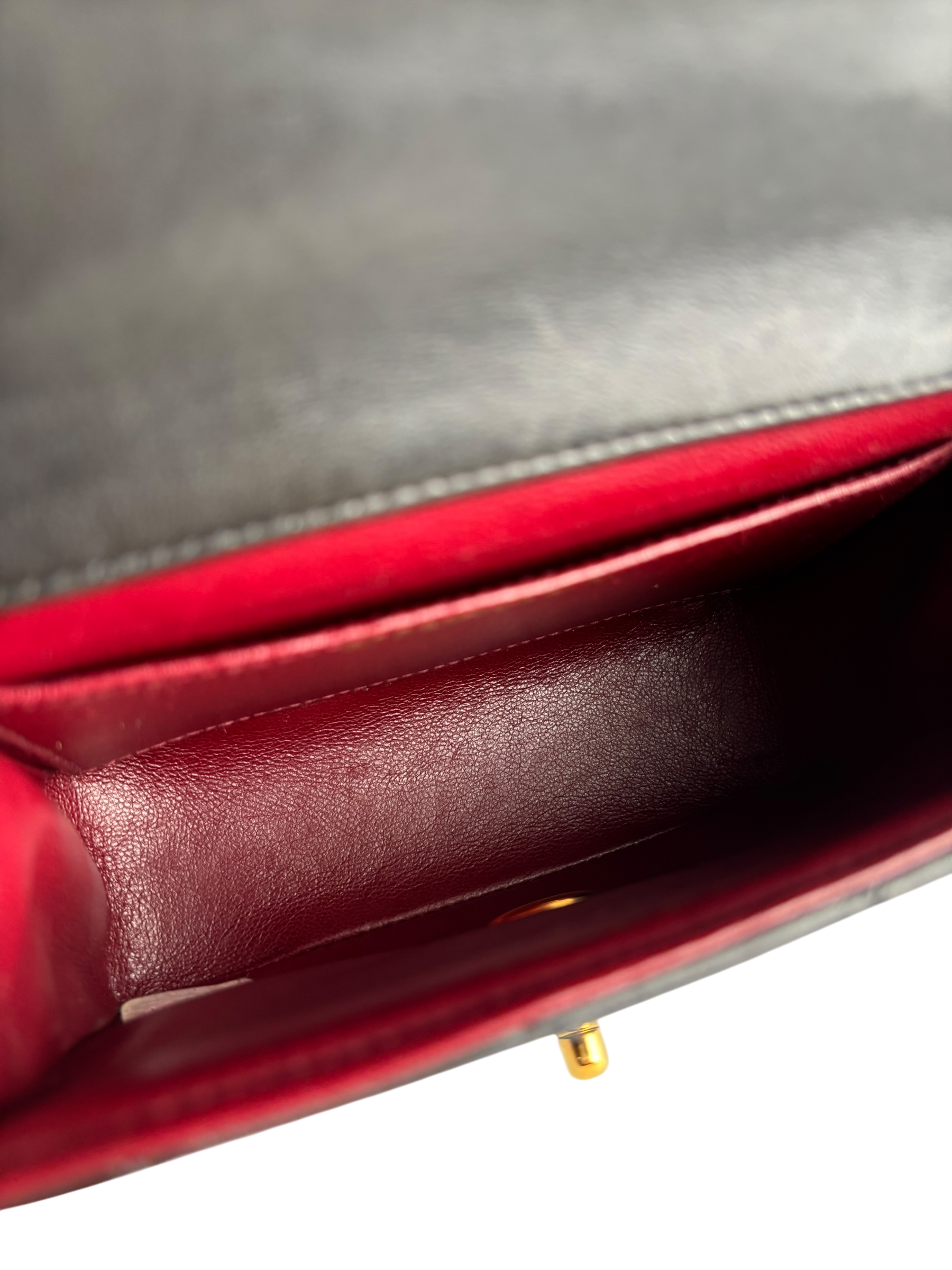 CHANEL - Black Lambskin Micro Classic Flap Handbag