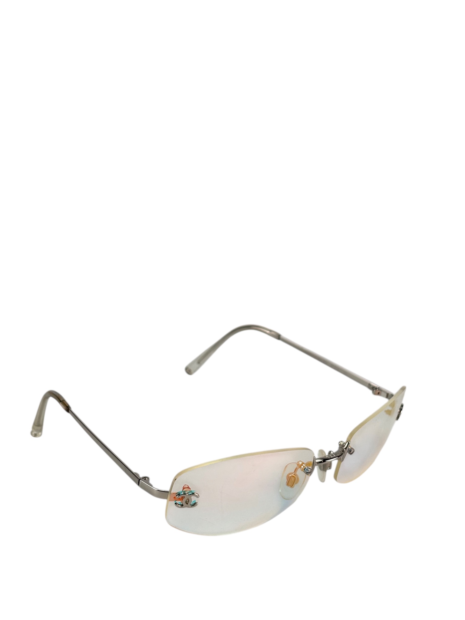 CHANEL - Rimless Iridescent Oval Sunglasses in Blue