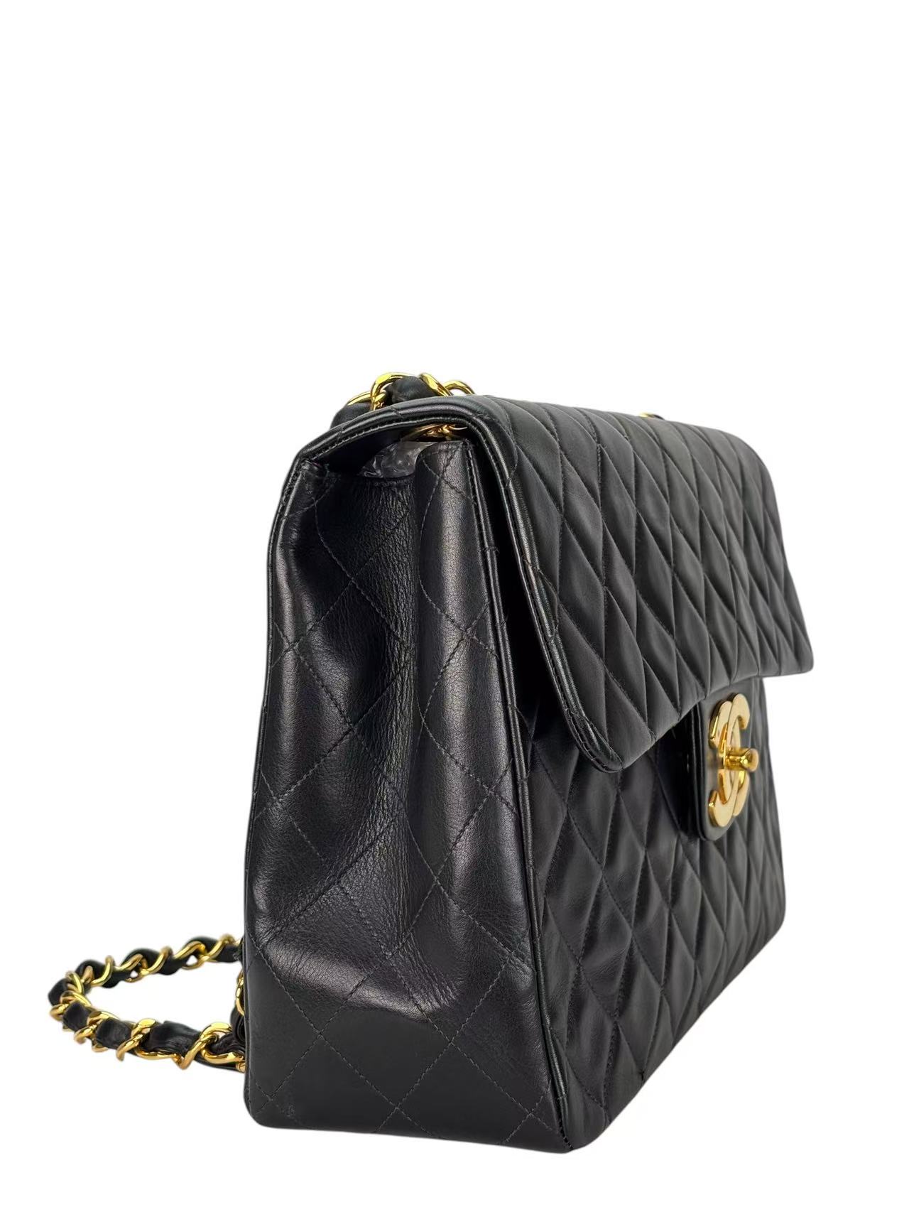 CHANEL - Black Lambskin Maxi Classic Flap Bag