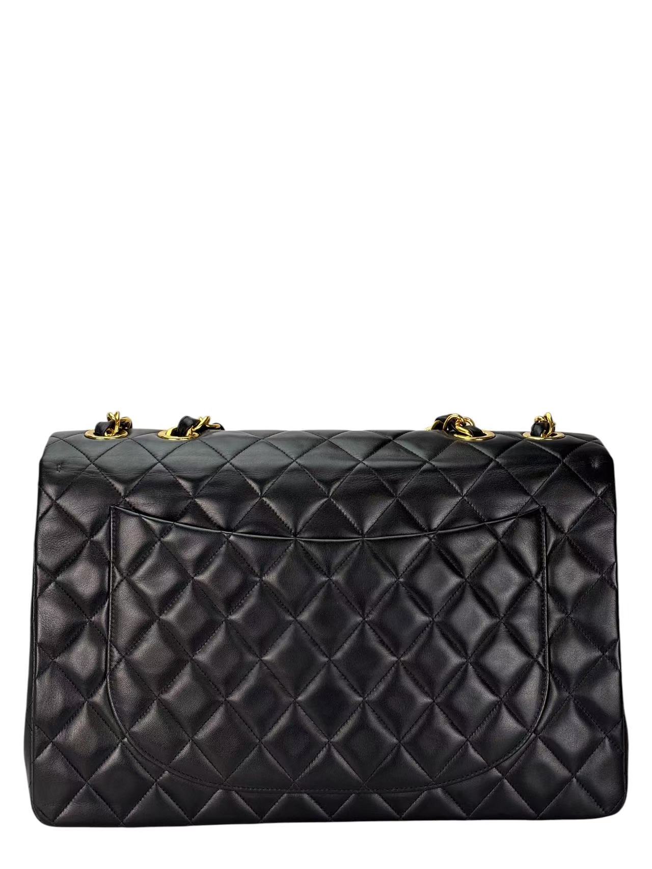 CHANEL - Black Lambskin Maxi Classic Flap Bag