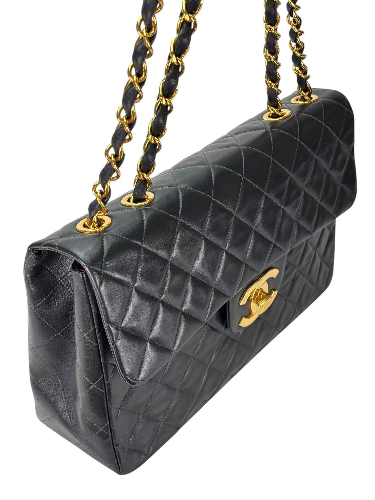 CHANEL - Black Lambskin Maxi Classic Flap Bag