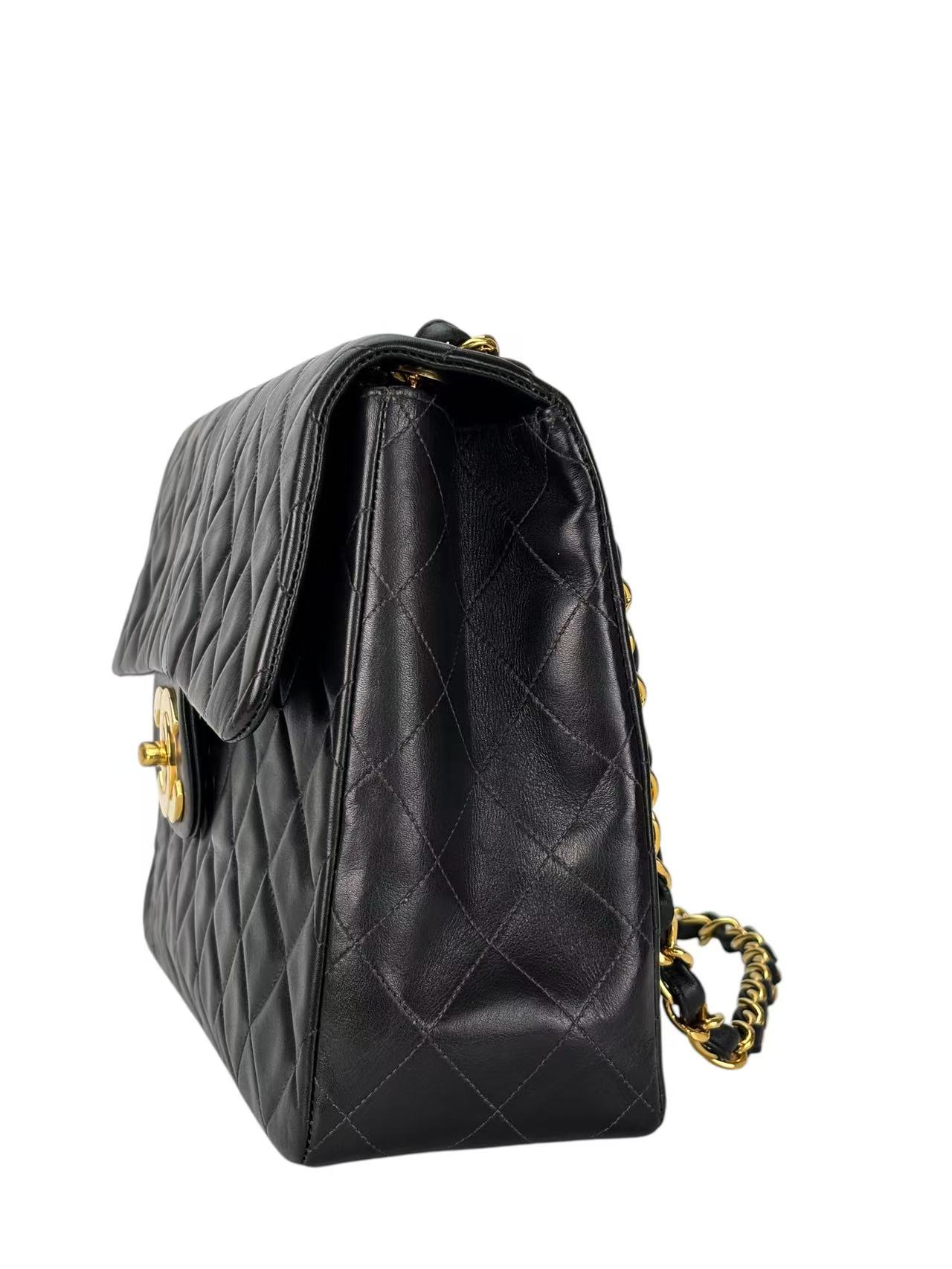 CHANEL - Black Lambskin Maxi Classic Flap Bag