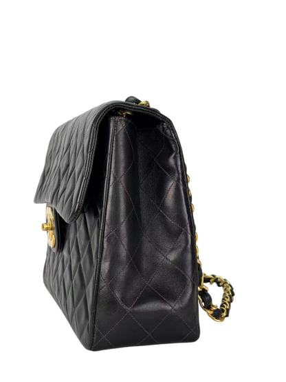 CHANEL - Black Lambskin Maxi Classic Flap Bag