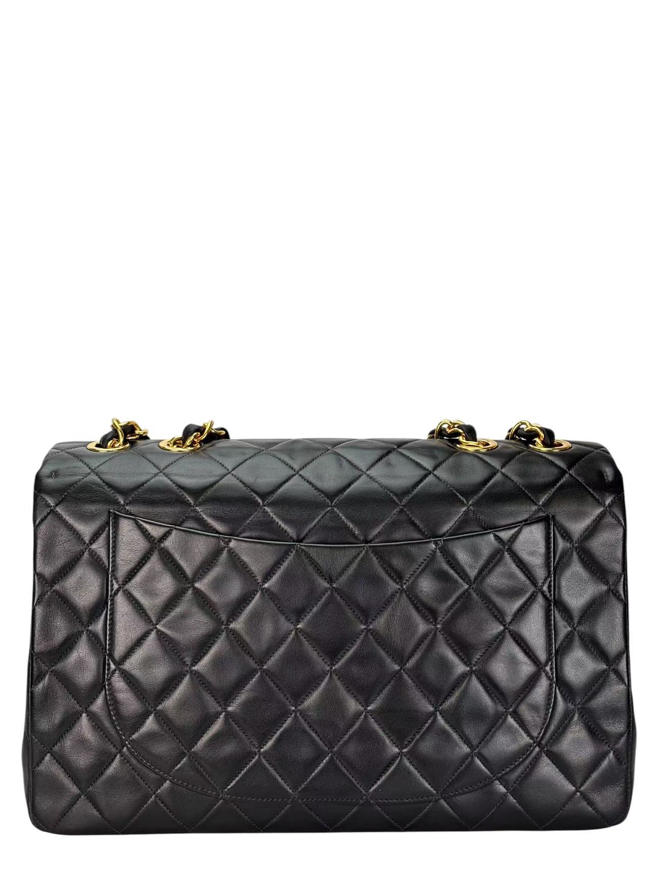 CHANEL - Black Lambskin Maxi Classic Flap Bag