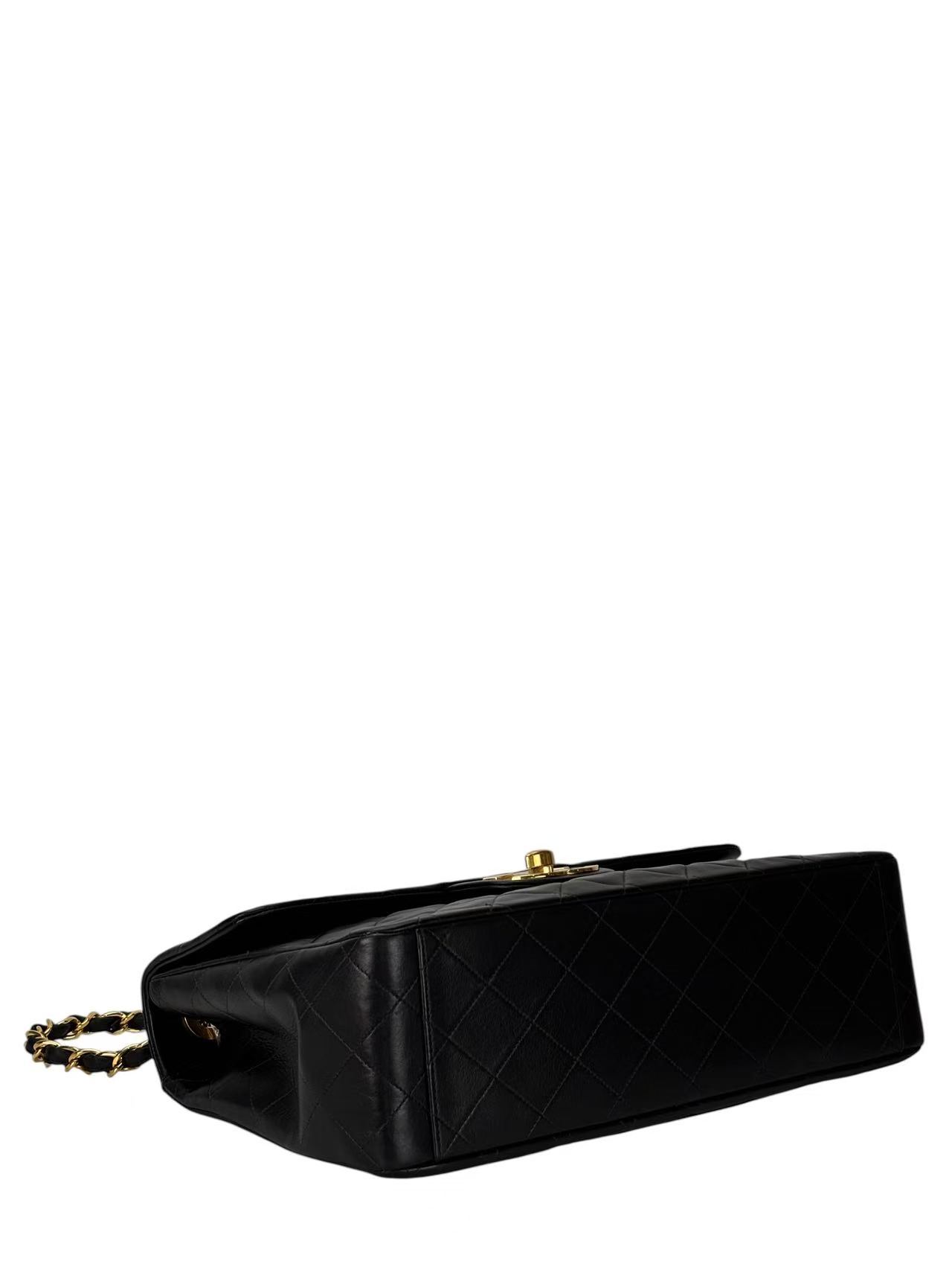 CHANEL - Black Lambskin Maxi Classic Flap Bag