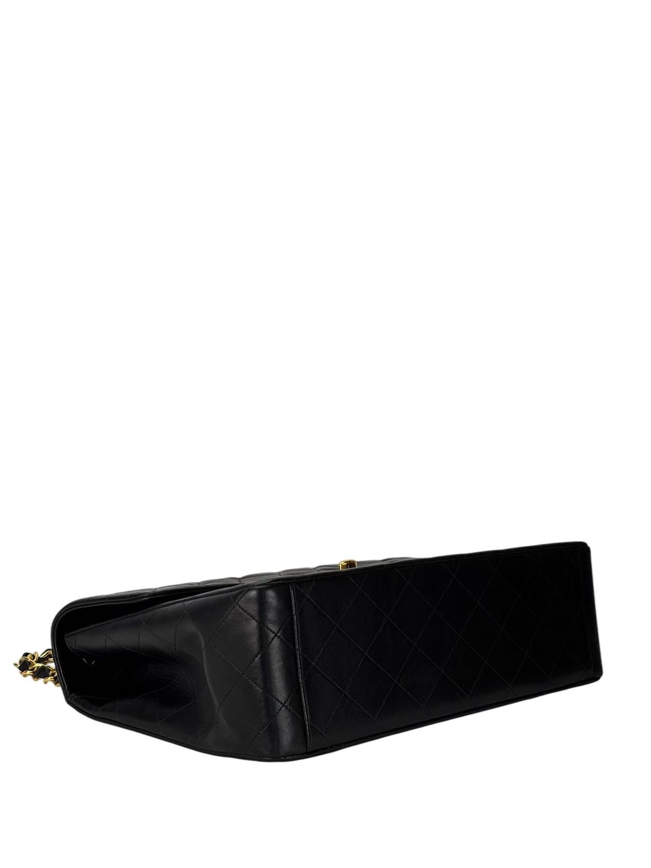 CHANEL - Black Lambskin Maxi Classic Flap Bag