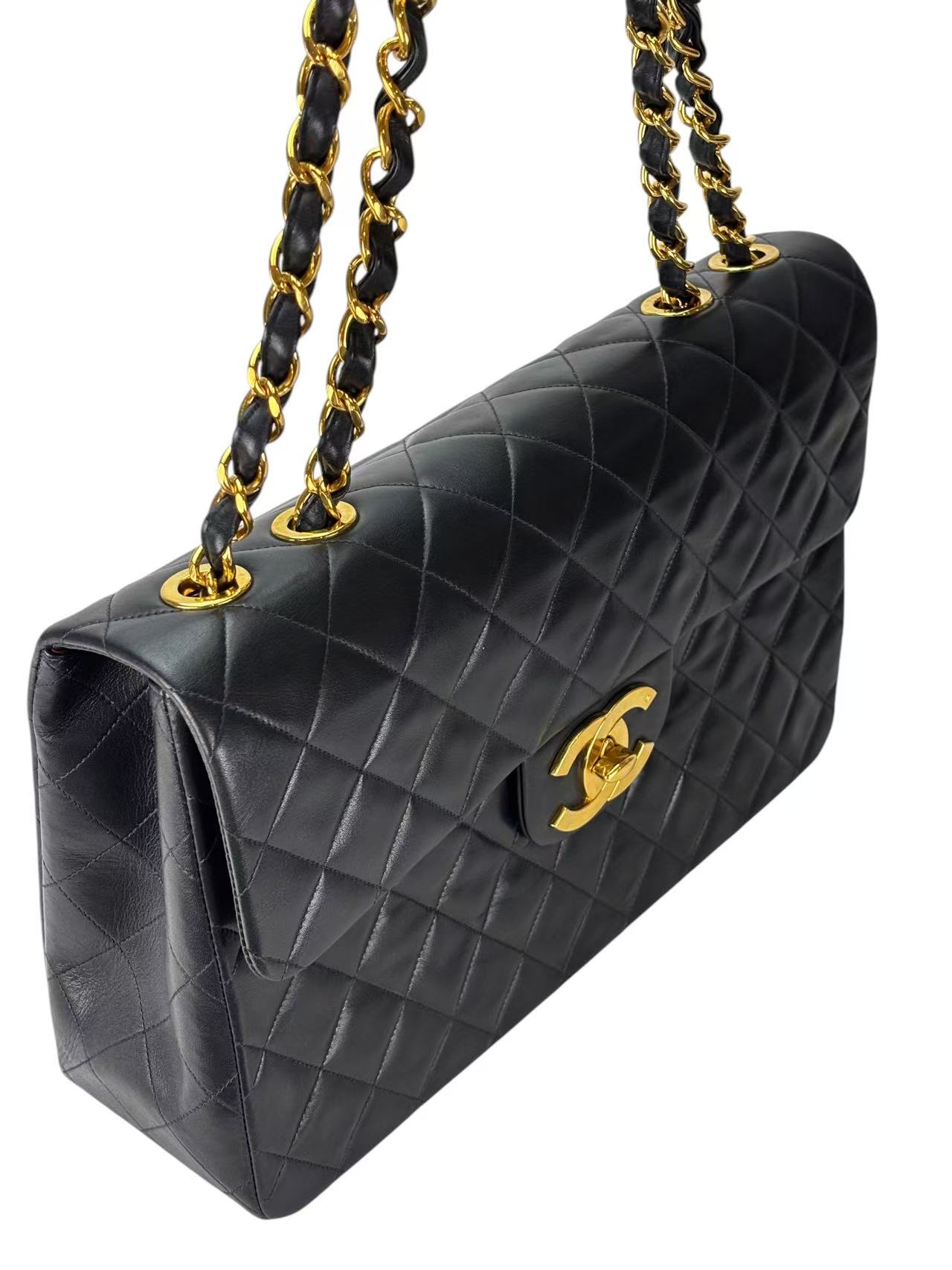 CHANEL - Black Lambskin Maxi Classic Flap Bag