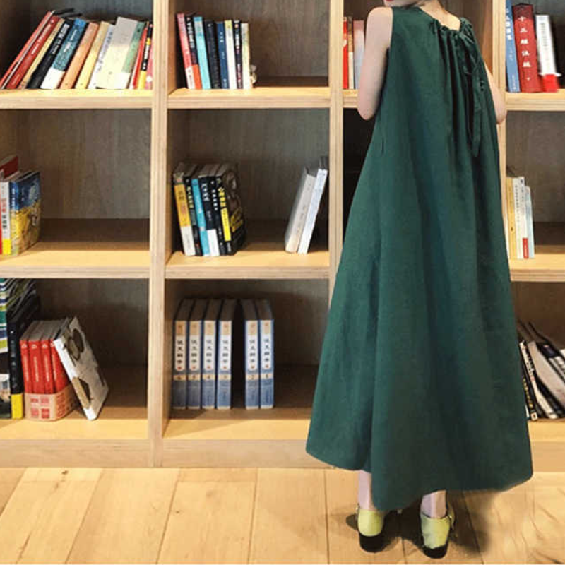 墨綠鬆身A字長裙｜及踝大口袋 × 後背交叉繫帶背心裙