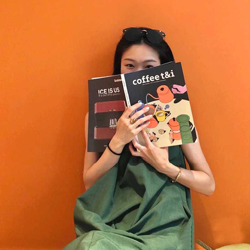 墨綠鬆身A字長裙｜及踝大口袋 × 後背交叉繫帶背心裙