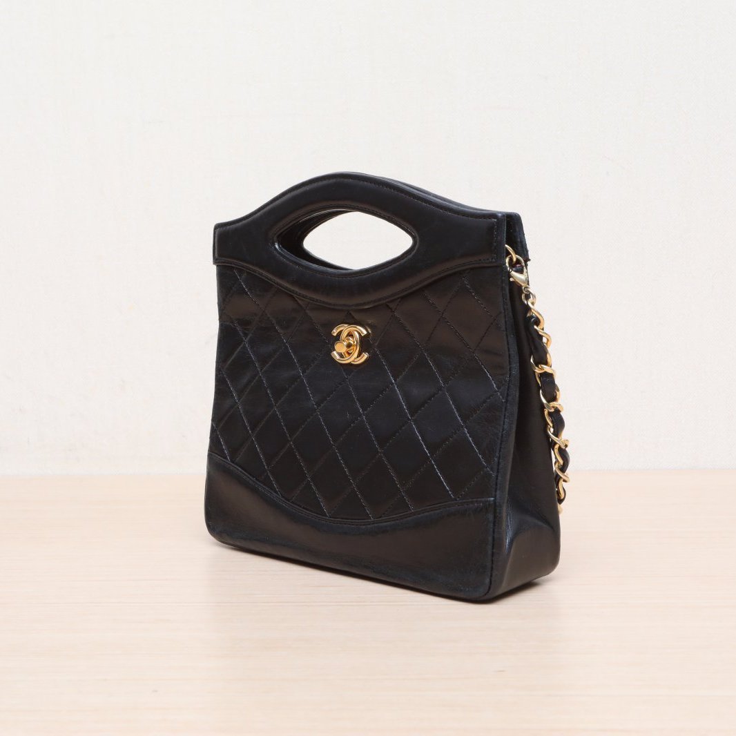 CHANEL Vintage Mini 31 Black and Gold Lambskin Bag