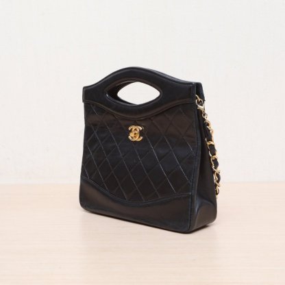CHANEL Vintage Mini 31 Black and Gold Lambskin Bag