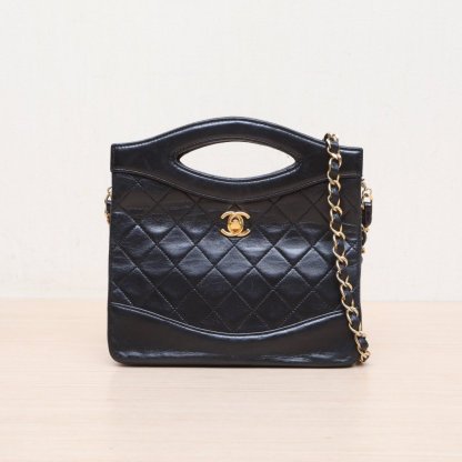 CHANEL Vintage Mini 31 Black and Gold Lambskin Bag