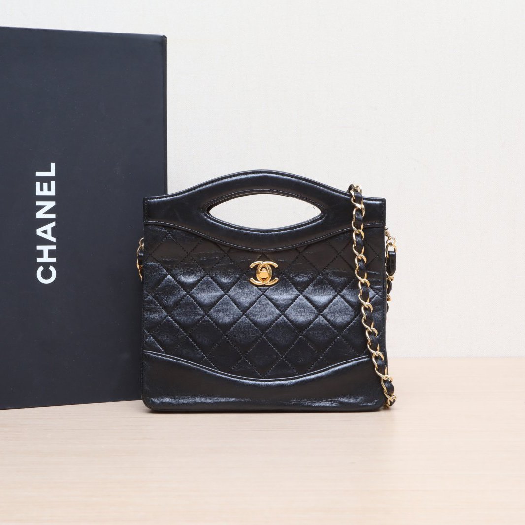 CHANEL Vintage Mini 31 Black and Gold Lambskin Bag
