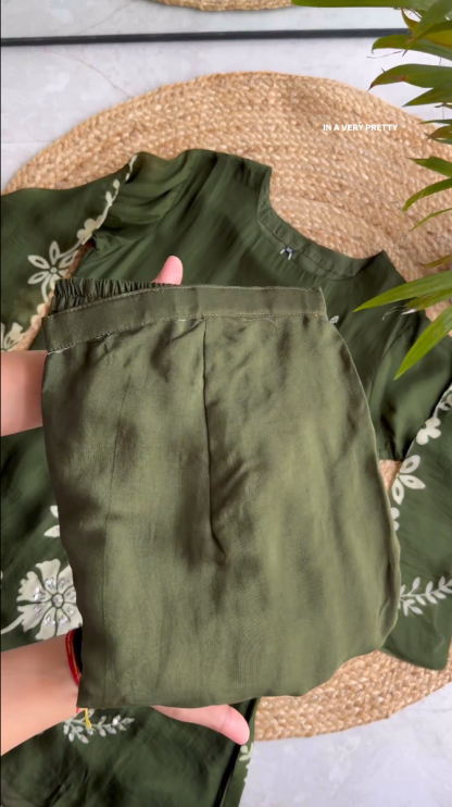 Blossom into Spring with Our Green Embroidered Top