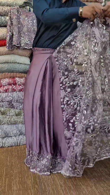 Elegant Purple Net Saree with Intricate Design