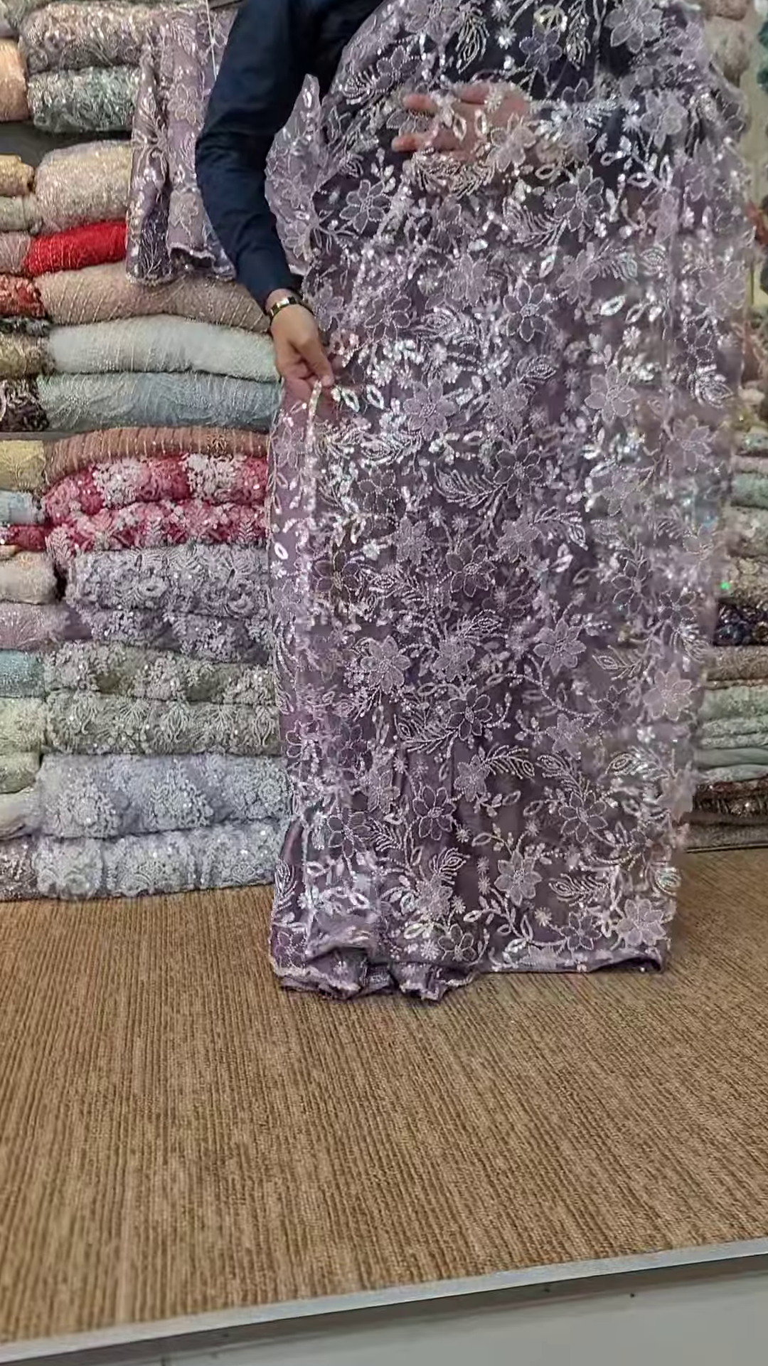 Elegant Purple Net Saree with Intricate Design