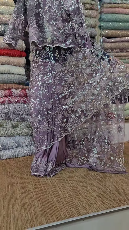 Elegant Purple Net Saree with Intricate Design