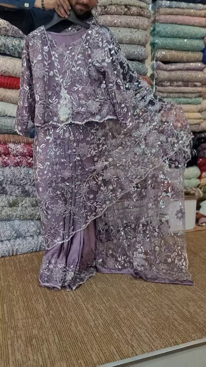 Elegant Purple Net Saree with Intricate Design