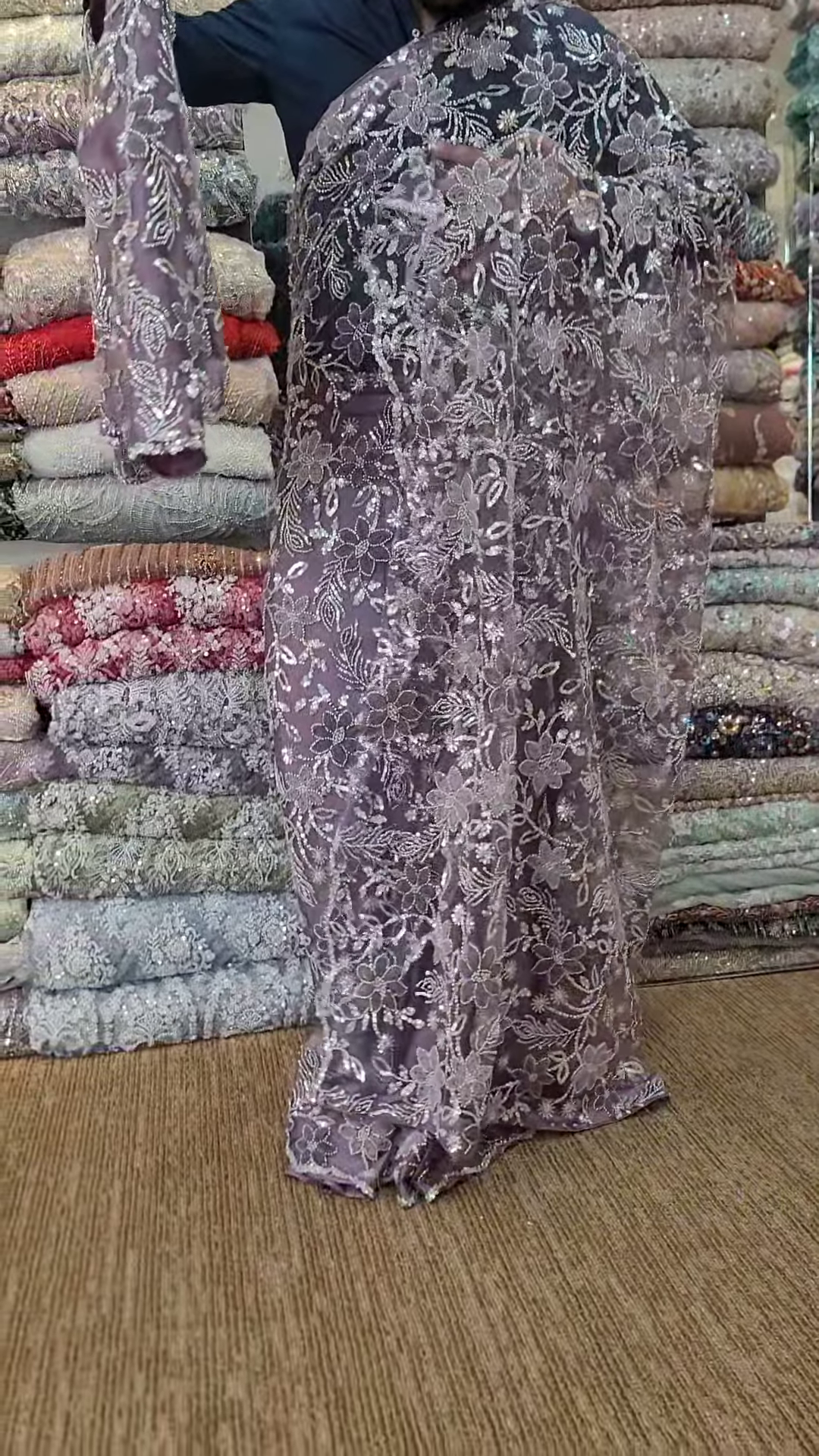 Elegant Purple Net Saree with Intricate Design