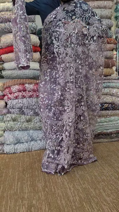 Elegant Purple Net Saree with Intricate Design